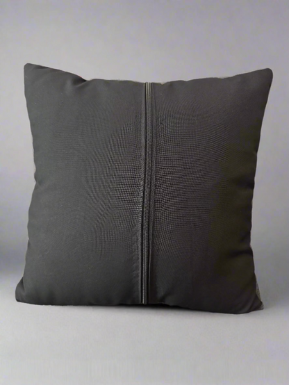 back of a pillowcase with a zipper on a light gray background