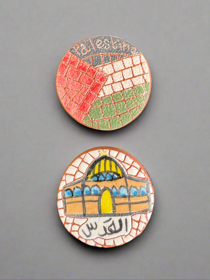 Two round, colorful ceramic tiles with mosaic patterns of Palestine