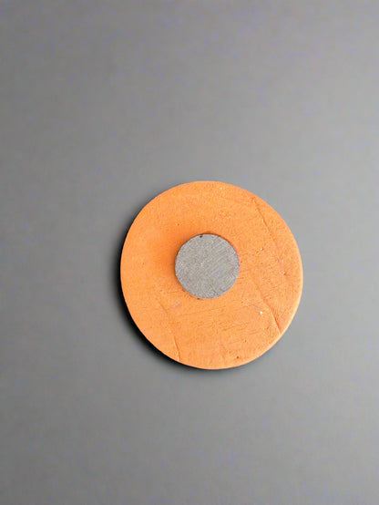 The back of the small round magnets