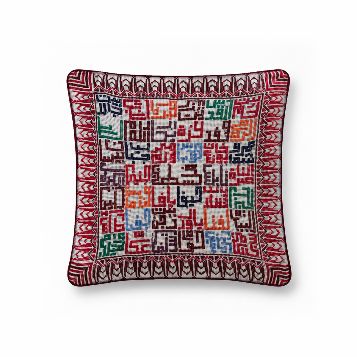 Cities of Home hand-stitched cushion with Palestinian city-name artwork, standalone studio view